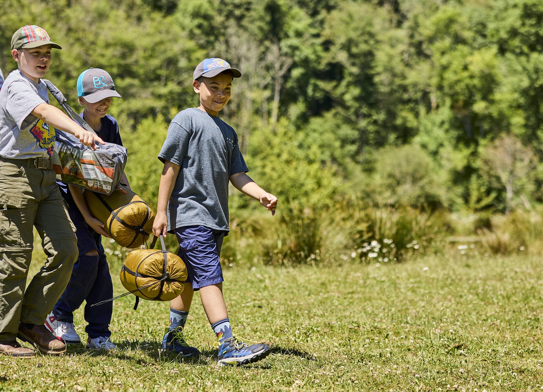 Scouts walking with camping gear